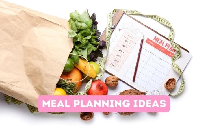 bag of fruit and vegetables and a meal planning sheet on a clipboard with a pen