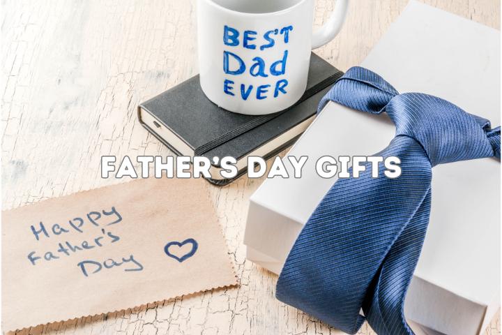 gift box with bow tie tied around it, best dad ever cup on a book, happy fathers day note