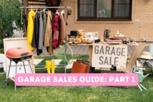 garage sale sign, color clothes on a rack, bbq grill, kitchen stuff on table