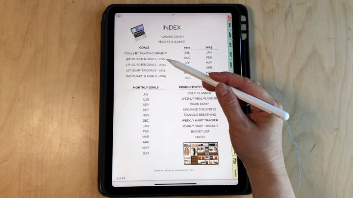 Image: digital planner for ipad index page on ipad with apple pencil pointed to it